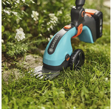 Gardena Akku-Grasschere im Einsatz im Garten.