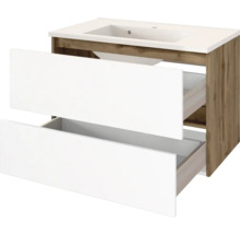 Waschtischunterschrank mit zwei weißen Schubladen und integriertem Waschbecken, Korpus in Eiche-Optik.