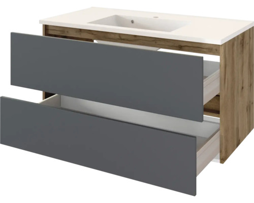 Waschtischunterschrank mit integriertem Waschbecken, zwei grauen Auszügen und Korpus in Holzoptik.