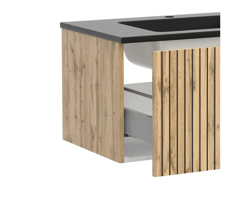 Waschbeckenunterschrank in Eiche-Optik mit schwarzem Waschbecken und Lamellenfront, eine Schublade ist geöffnet.