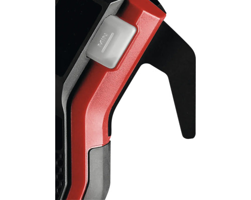 Nahaufnahme einer Metallsäge mit rotem Griff und Schalter für die minimale Einstellung