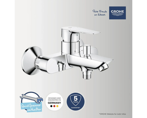 Grohe Logo. Grohe Einhand-Wannenbatterie für Wandmontage, Umsteller, Brauseabgang, 5 Jahre Garantie, in Deutschland entwickelt, Montageschlüssel.