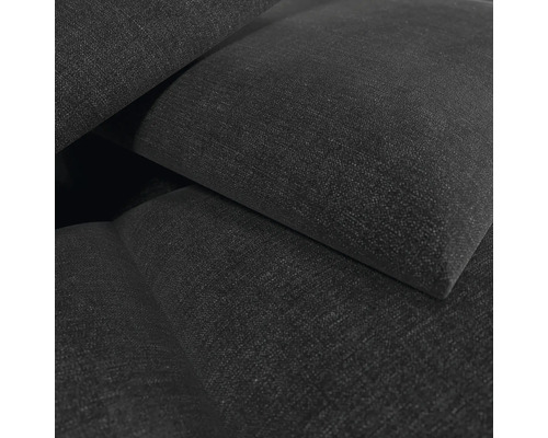 Detailansicht eines Polstermöbelstücks mit gewebter Stoffoberfläche.