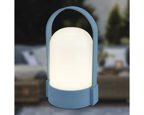 Blaue portable LED-Außenleuchte mit weißem, abgerundetem Schirm und Tragegriff.