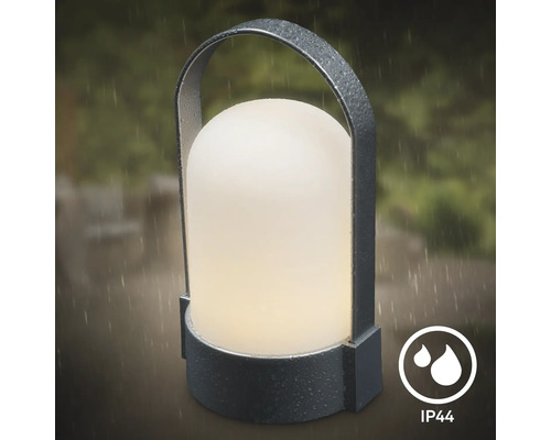 Tragbare LED-Außenleuchte mit Bügelgriff und Schutzart IP44, geeignet für die Verwendung im Regen.
