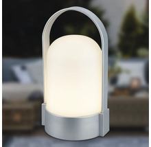 Tragbare LED-Tischleuchte mit silberfarbenem Fuß und Bügelgriff, kuppelförmiger Schirm, warmweißes Licht.
