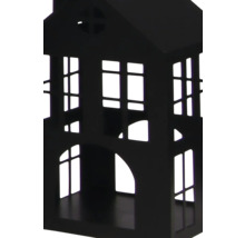 Dekoratives Haus aus schwarzem Metall mit ausgeschnittenen Fenstern und Türen.