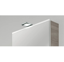Quadratische LED-Aufsatzleuchte in Chrom-Optik für Spiegelschränke.