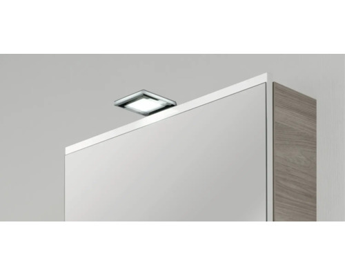Quadratische LED-Aufsatzleuchte in Chrom-Optik für Spiegelschränke.