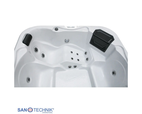 Innenansicht eines Whirlpools mit Massagedüsen, Nackenstütze und San Technik International Logo