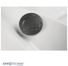 Sanotechnik Massagedüse für Whirlpool in Schwarz mit Spiraldesign. Sanotechnik Logo.
