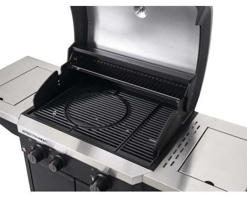 Geöffneter Tenneker Spectra Gasgrill mit gusseisernem Grillrost inklusive kreisförmigem Einsatz, Warmhalterost und Seitenablagen.