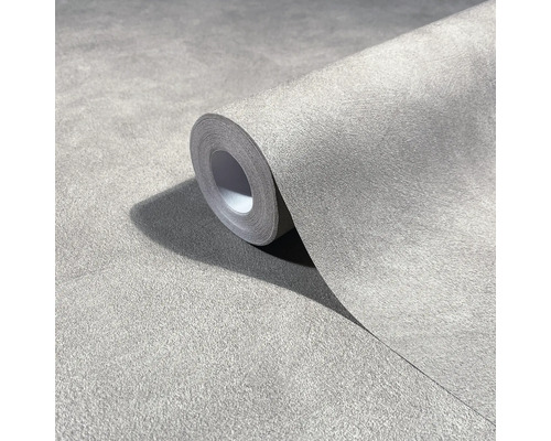 Rolle Vliestapete in Betonoptik mit strukturierter Oberfläche zur Wandgestaltung.
