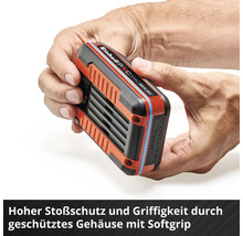 Einhell Logo, Einhell Akku mit Softgrip Gehäuse in den Händen gehalten zur Veranschaulichung des Stoßschutzes