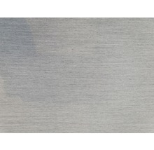 Nahaufnahme eines hellen Stoffes mit feiner Textur.