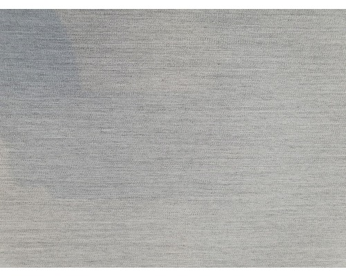 Nahaufnahme eines hellen Stoffes mit feiner Textur.