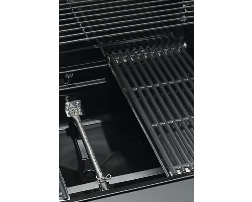 Innenraum eines Grills mit Grillrost und Brenner