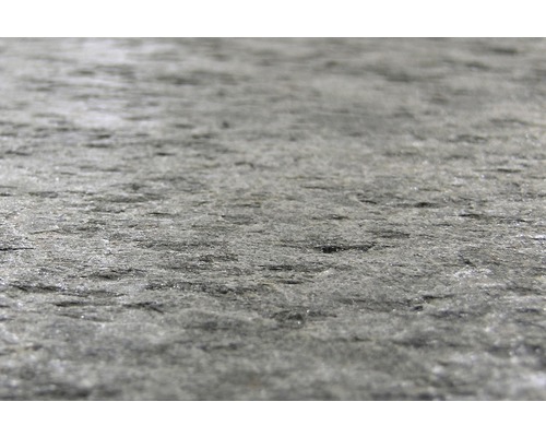 Nahaufnahme einer Steinplatte mit rauer Oberfläche.