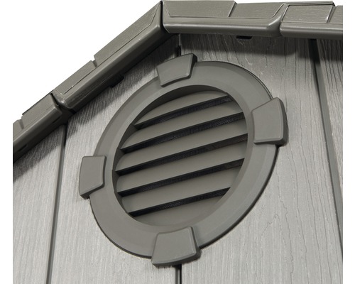 Detailansicht einer Gartenhütte mit runder Lüftungsöffnung