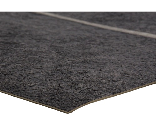 Nahaufnahme einer Bodenfliese mit rauer Textur und Steinoptik