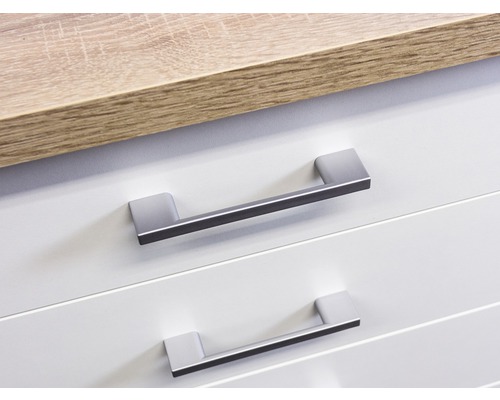 Detailaufnahme von zwei Schubladen mit Griffen und einer Arbeitsplatte.