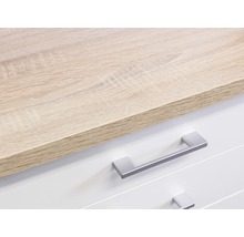 Detailaufnahme einer Kommode mit Schubladen und einer Holzplatte