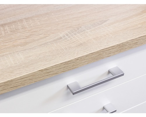Detailaufnahme einer Kommode mit Schubladen und einer Holzplatte