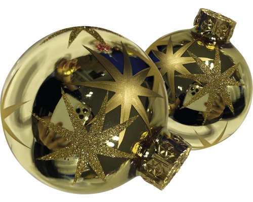 Zwei Christbaumkugeln mit Sternmotiven