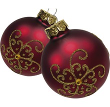 Zwei rote Weihnachtskugeln mit goldfarbenen Verzierungen
