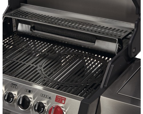 Innenansicht eines Gasgrills mit Grillrost und Warmhalterost