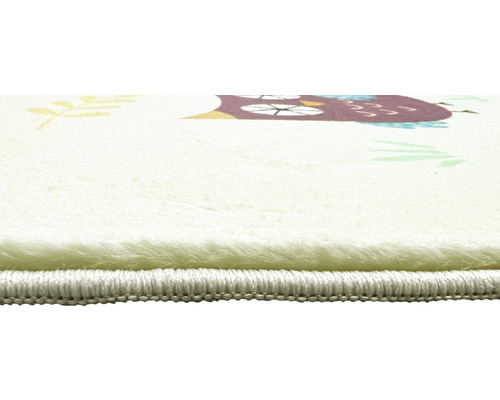 Detailansicht eines Teppichs mit Eulenmotiv