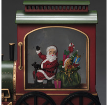 Weihnachtliche Eisenbahn mit Weihnachtsmann, Geschenken und Teddybär