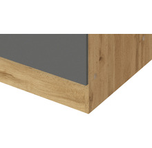 Detailaufnahme eines Möbelstücks mit Holzstruktur und grauer Oberfläche