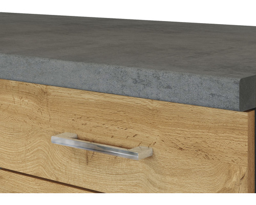 Detailaufnahme eines Schubladenelements mit Platte in Betonoptik und einem Griff aus Metall