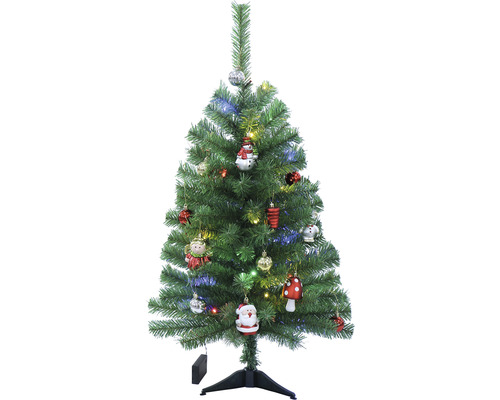 Geschmückter künstlicher Weihnachtsbaum auf einem Ständer.