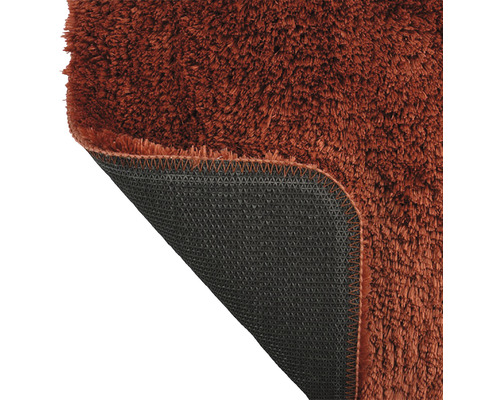 Detailansicht eines Teppichs mit Flor und rutschfester Rückseite