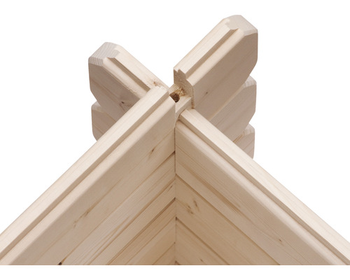 Detailaufnahme einer Eckverbindung eines Holzhauses