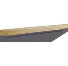 Detailansicht eines Möbelstücks mit Holzplatte und Schublade