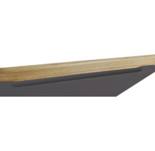 Detailansicht eines Möbelstücks mit Holzplatte und Schublade