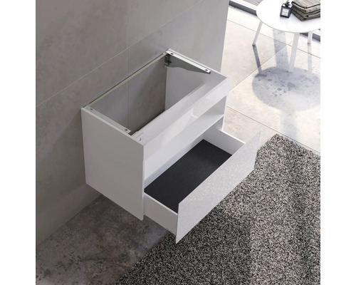Weißer Waschbeckenunterschrank mit offener Schublade für das Badezimmer.