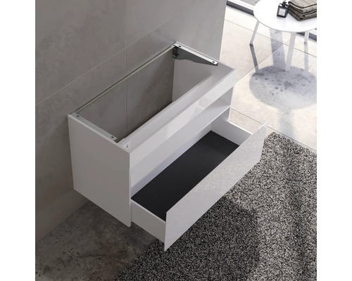 Weißer Waschtisch mit offener Schublade und Montagevorrichtung an der Wand