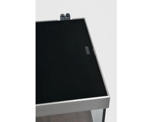 Detailansicht eines Aquariums mit schwarzer Glasabdeckung und zugehörigen Bedienelementen