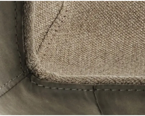 Detailaufnahme eines Möbelstücks mit Stoff- und Lederbezug