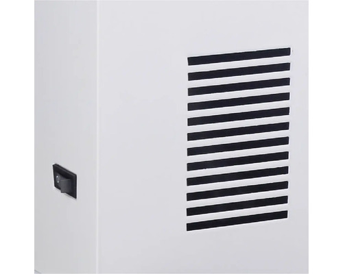 Detailansicht von einem Belüftungsgitter und einem Schalter.