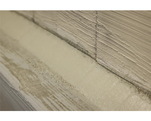 Nahaufnahme einer Wand mit Putz