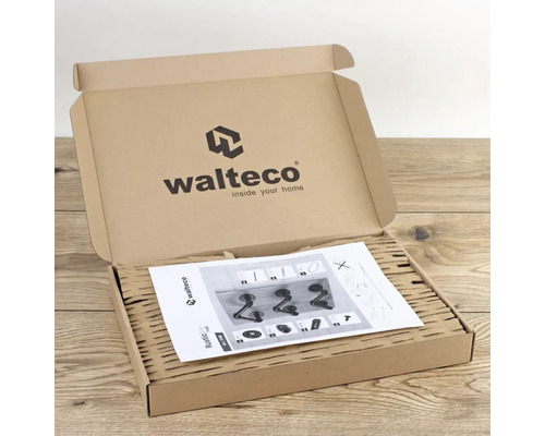 Offener Karton mit Montageanleitung für eine Wandgarderobe von Walteco