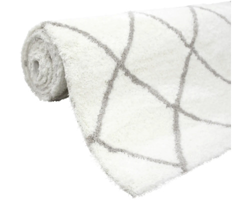 Gerollter Teppich mit geometrischem Muster