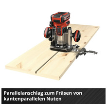 Oberfräse mit Parallelanschlag auf einem Holzbrett für kantenparallele Nuten