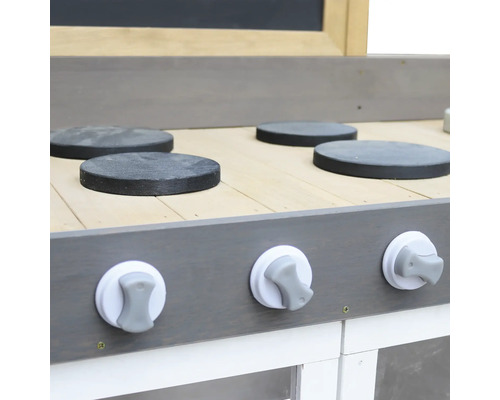 Detailansicht einer Spielküche mit Kochfeldern und Drehknöpfen.