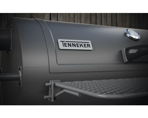 Nahaufnahme des Tenneker Grillthermometers, des Tenneker Logos und des Warmhalterosts